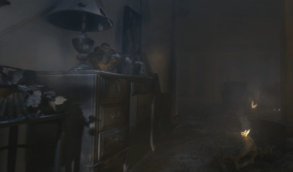 Worker treating a smoke-damaged ceiling